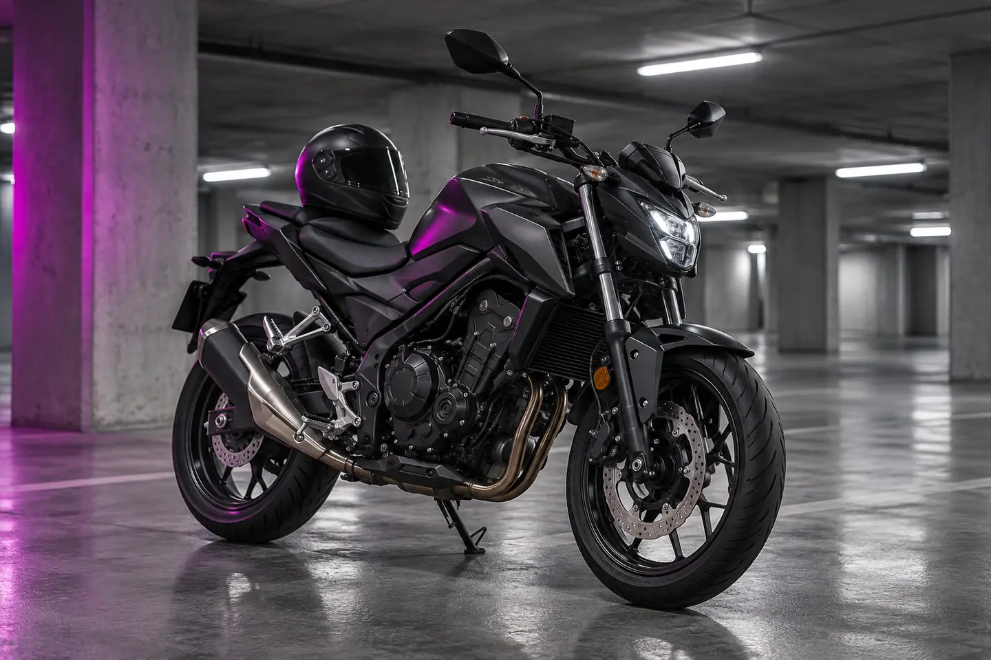 Black motorcycle in a car park with magenta lighting